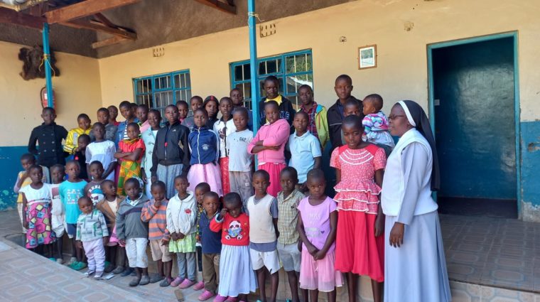 Sister and school children