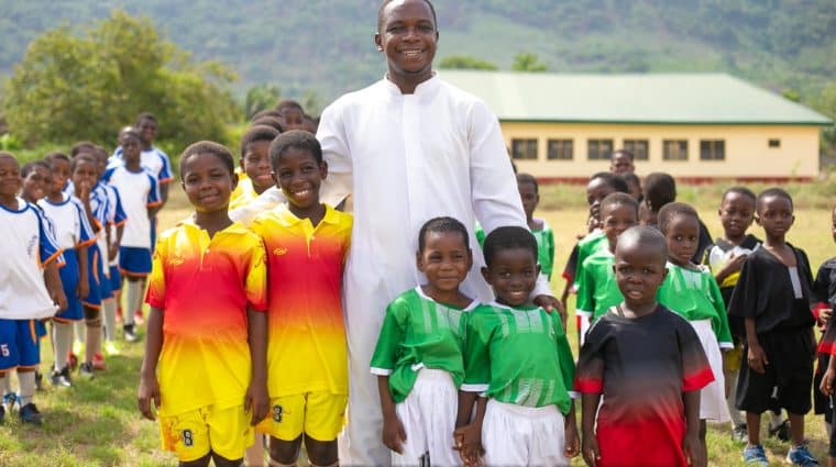 students of bishop konzen school smile for a photo