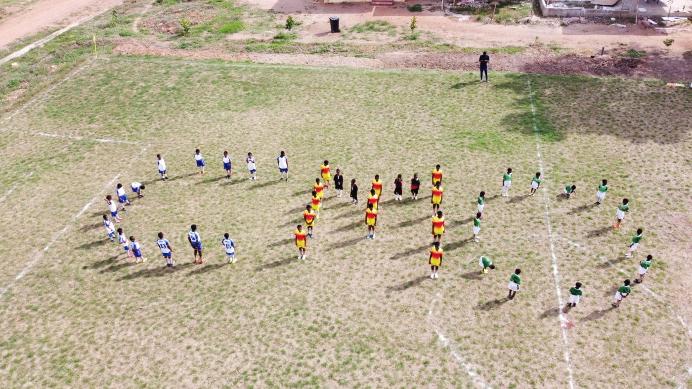 students of bishop konzen school spell out Catholic Mission outreach (CMO)
