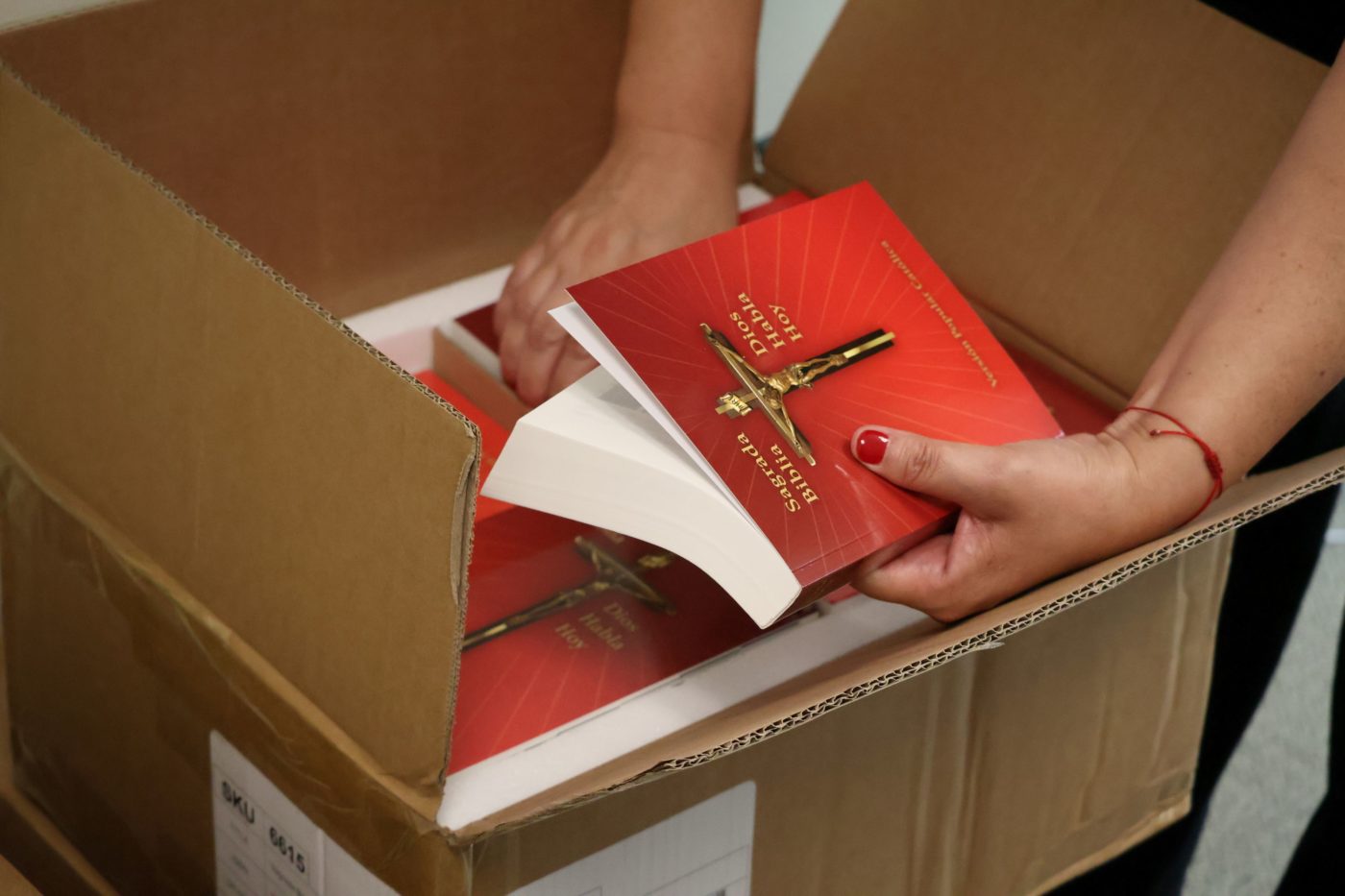 Opening the boxes containing 160 Spanish-language Bibles