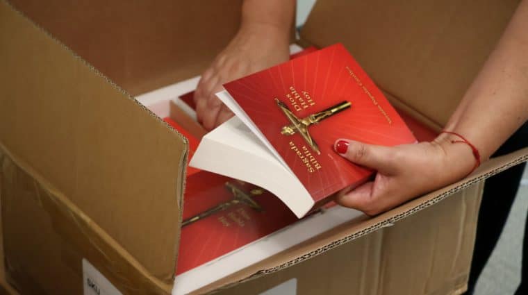 Opening the boxes containing 160 Spanish-language Bibles