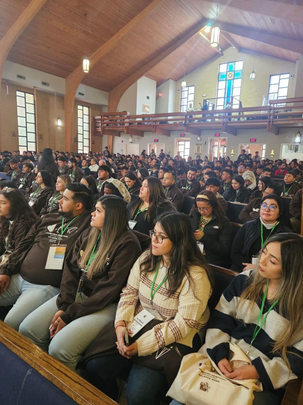 Young adults fill the pews of a church