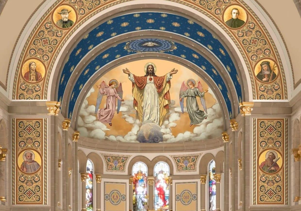 The front arched ceiling of a church adorned with religious art and stained glass windows