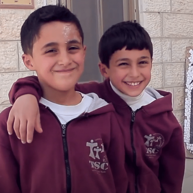 Two boys from the franciscan boys home smile